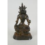 A Sino Tibetan gilt bronzed metal figure of Buddha, 4 character mark to the reverse, 27cm high