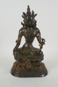 A Sino Tibetan gilt bronzed metal figure of Buddha, 4 character mark to the reverse, 27cm high