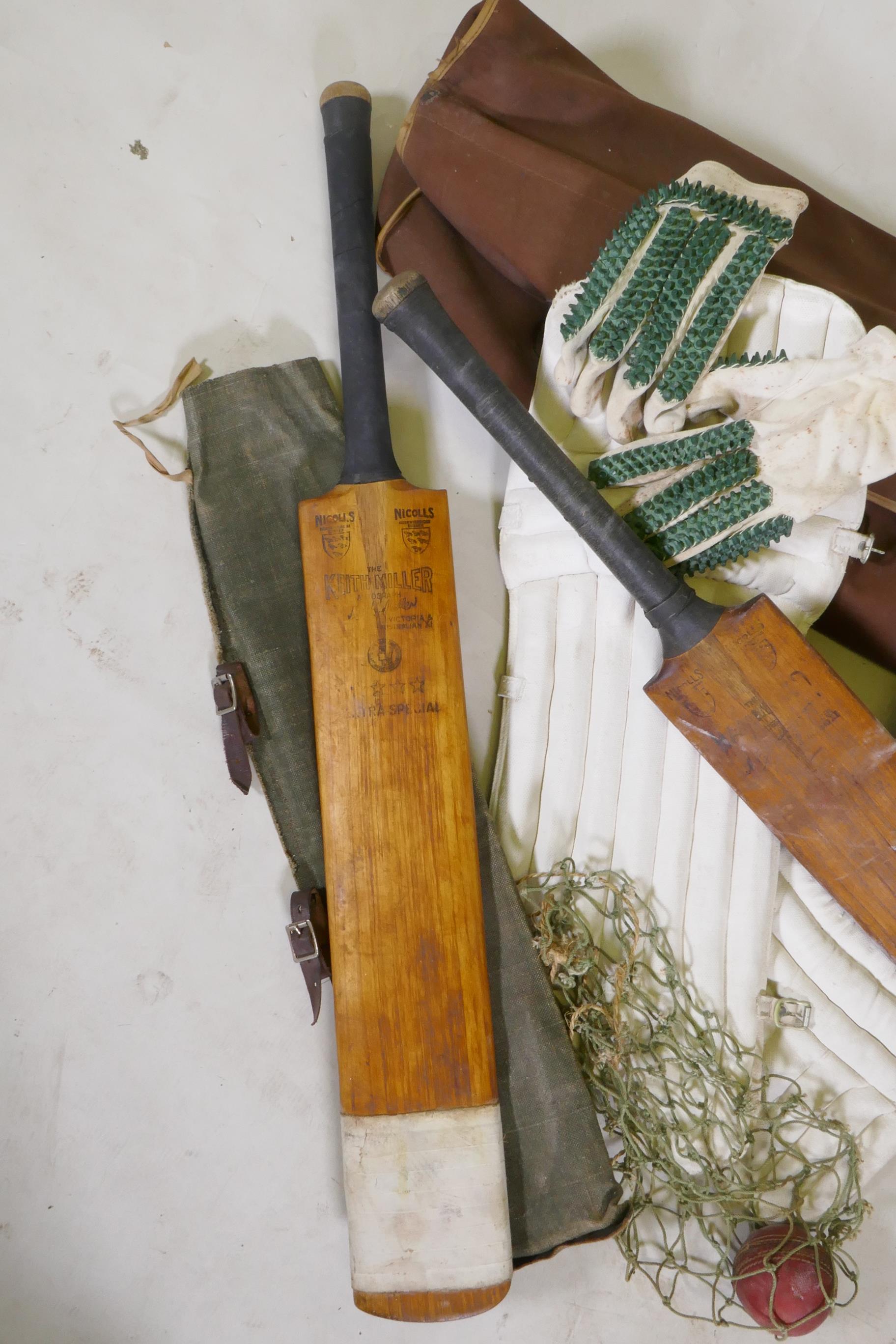 A collection of vintage cricket equipment to include two Keith Miller autograph bats, a set of pads, - Image 2 of 7