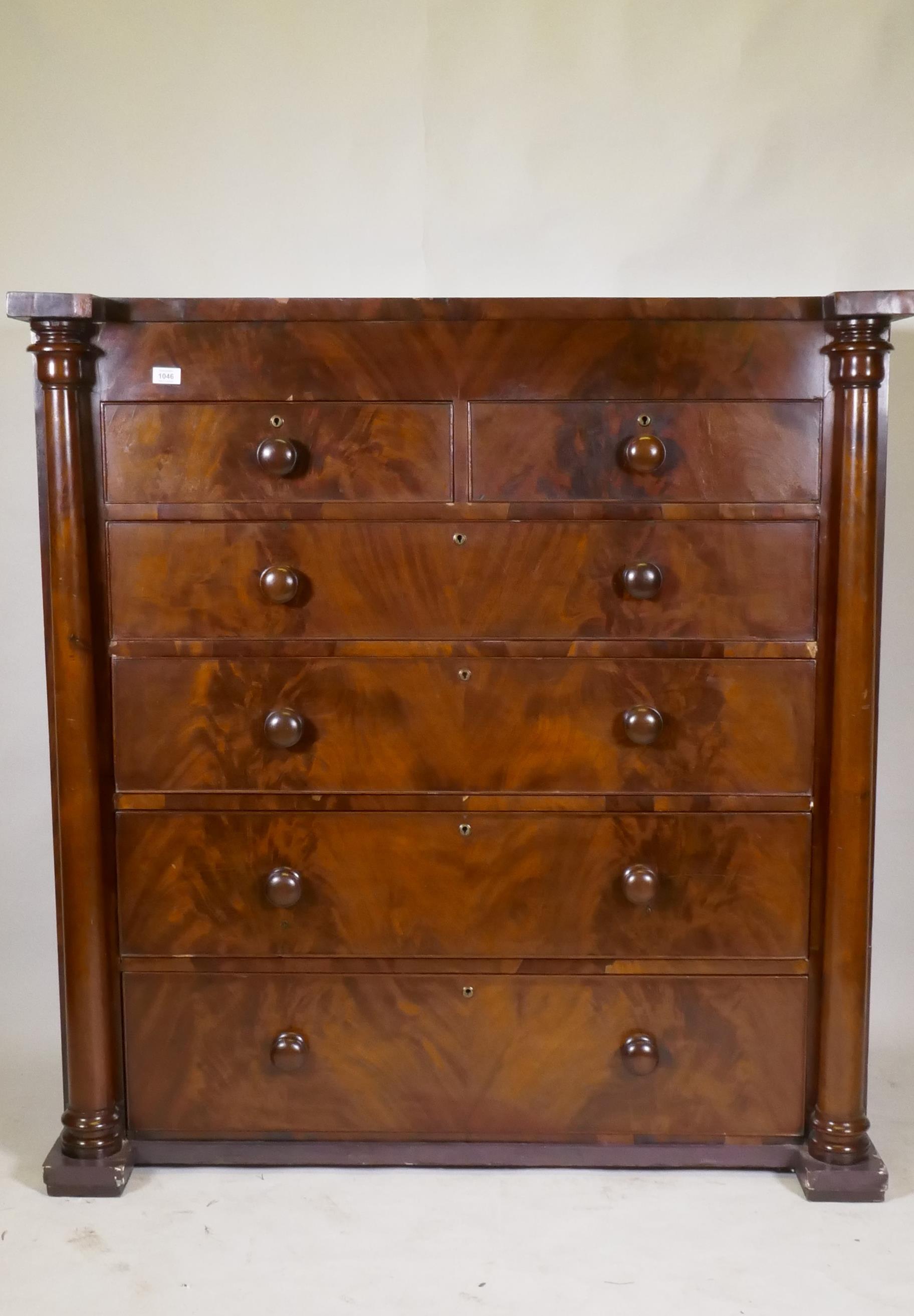 A Victorian flame mahogany Scotch chest of two over four drawers, with cock beaded detail and