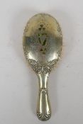 An antique Irish silver plated clothes brush, decorated with inlaid moss agate in the form of clover