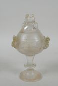 A Chinese moulded glass stem cup/censer and cover with kylin decoration, 15cm high