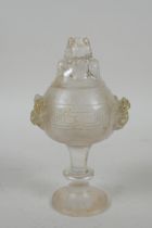 A Chinese moulded glass stem cup/censer and cover with kylin decoration, 15cm high