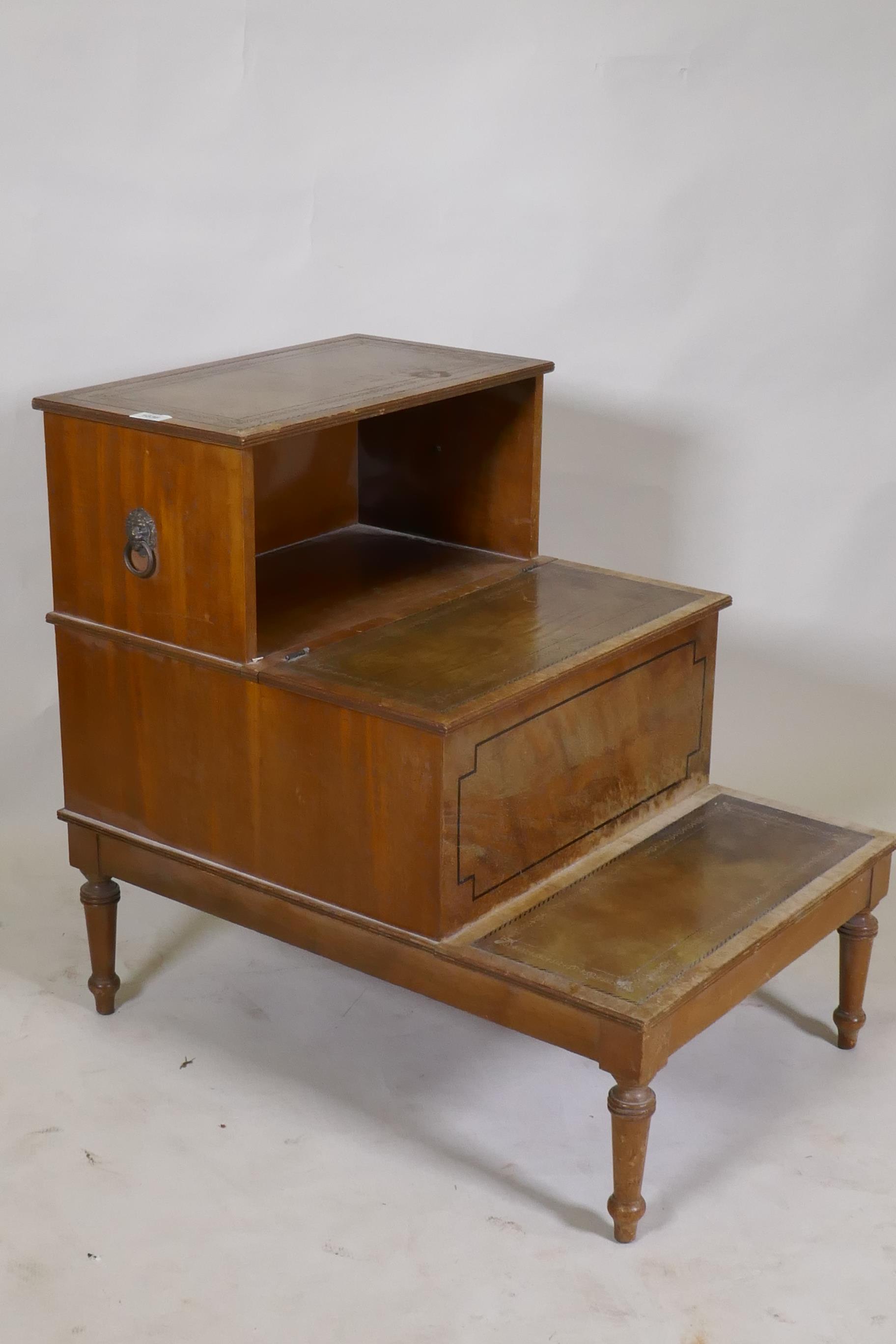 A set of library steps with leather inset treads, and lift up top on lion mask handles, 74 x 51 x - Image 4 of 4