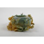 A Chinese bi colour jade pot decorated with birds and lotus flowers, AF, 16cm wide