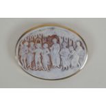 An antique cameo brooch depicting eight classical women in a 9ct yellow gold mount, 6.5 x 5cm