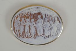 An antique cameo brooch depicting eight classical women in a 9ct yellow gold mount, 6.5 x 5cm