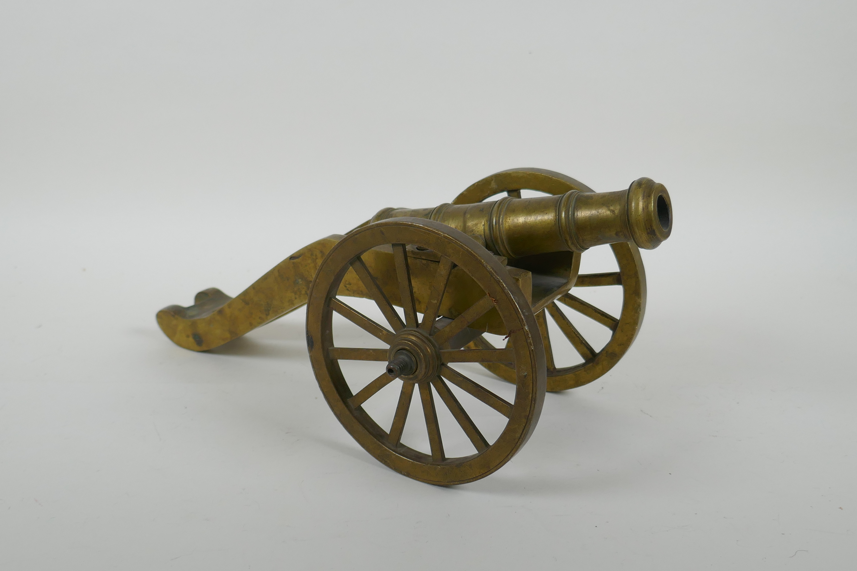 An antique bronze table canon, 33cm long, AF missing wheel nuts