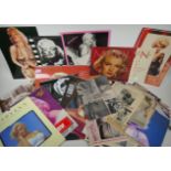 A large quantity of Marilyn Monroe ephemera to include calendars, press cuttings and posters,