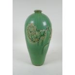 A Chinese celadon glazed porcelain vase with raised kylin decoration, 31cm high