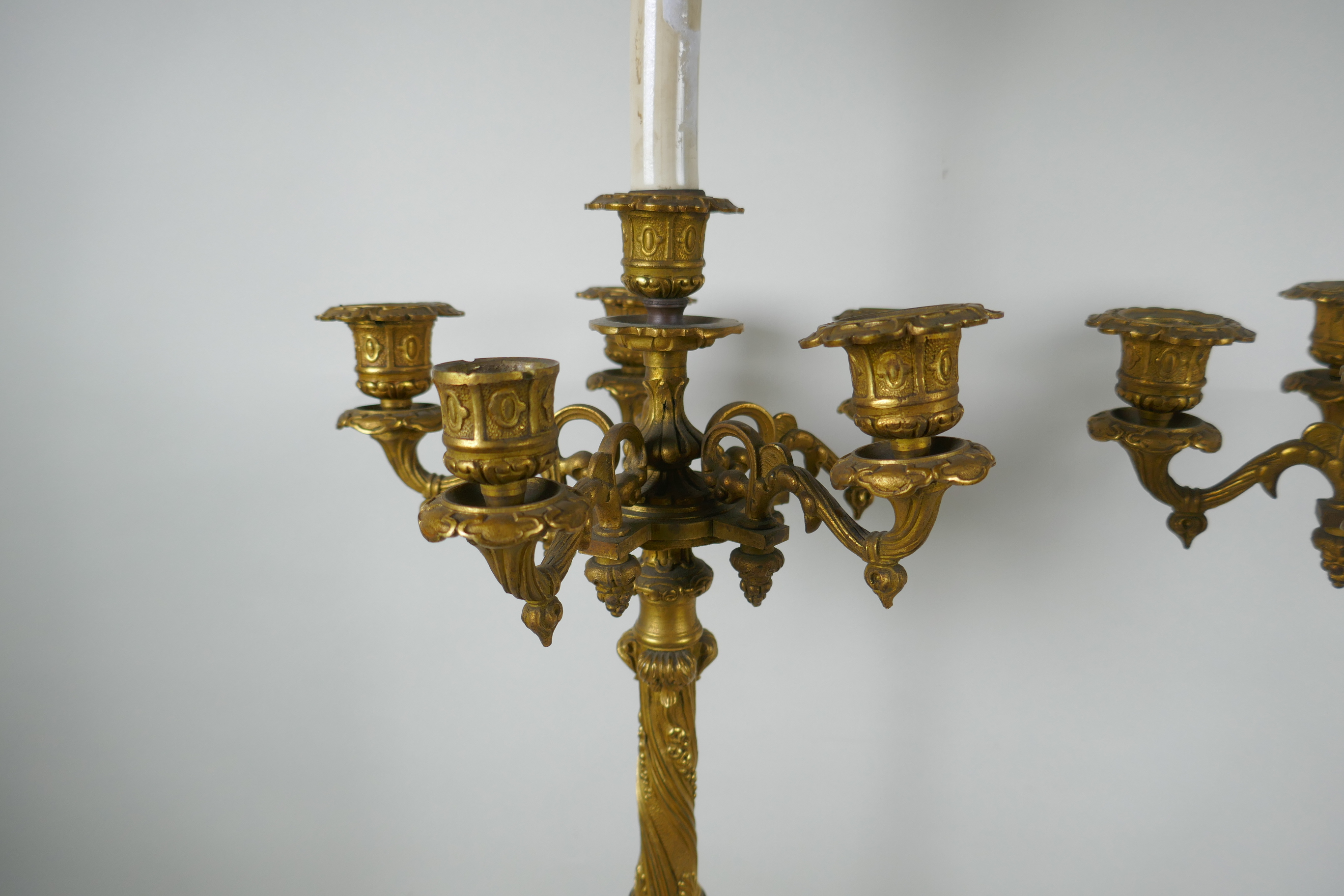 A pair of French ormolu five branch candlesticks on a tripod base with griffin decoration, the - Image 5 of 5
