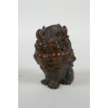 An oriental cast bronze stylised kylin, 6cm high