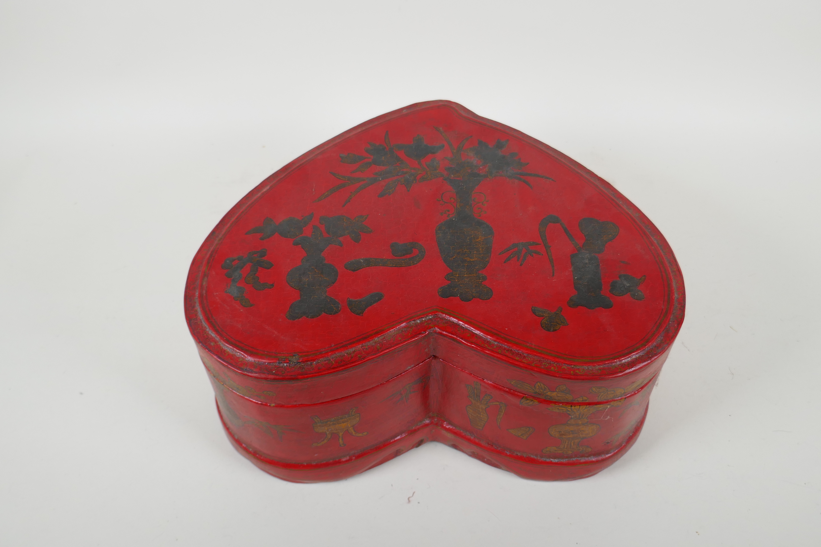 A Chinese red lacquered heart shaped box decorated with objects of virtue in gilt, 32 x 26cm - Image 2 of 6
