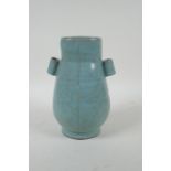 A Chinese celadon ge ware vase with two lug handles, 22cm high