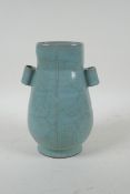 A Chinese celadon ge ware vase with two lug handles, 22cm high