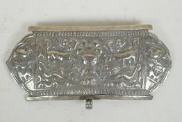A Chinese repousse white metal belt buckle decorated with mythical creatures and a goblet, 21 x 10cm