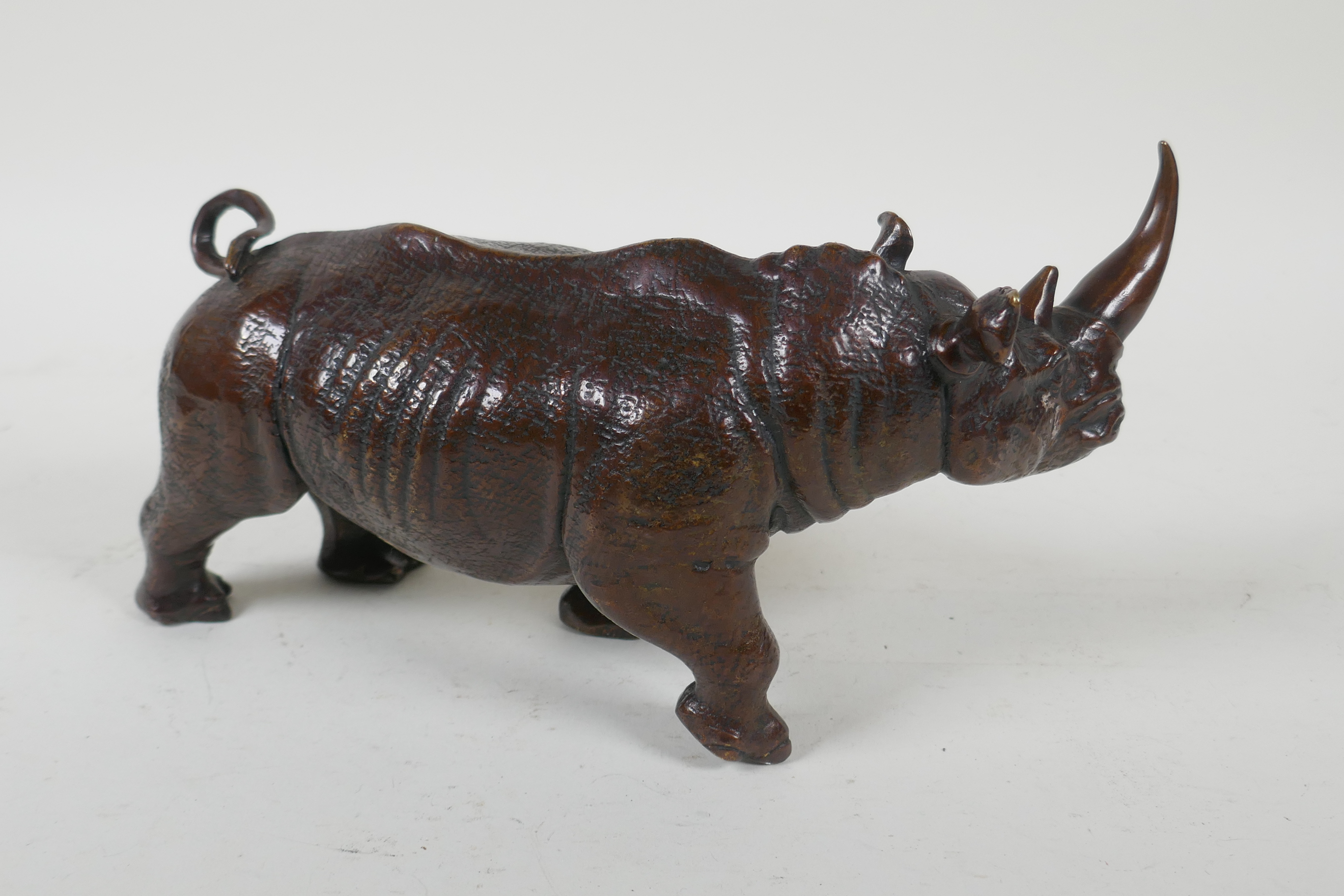 A filled bronze rhinoceros, 23cm long - Image 3 of 4