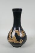 A Chinese Cizhou kiln bottle vase with dragon decoration, 29cm high