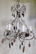 An antiqued copper six branch chandelier, with amethyst lustre drops, 100cm drop with chain, 56cm