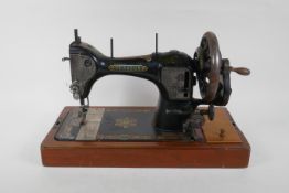 A vintage Hexagon handcrank sewing machine, manufactured by the Standard Sewing Machine Co,