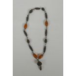 A Tibetan necklace with amber beads, 55cm long, AF
