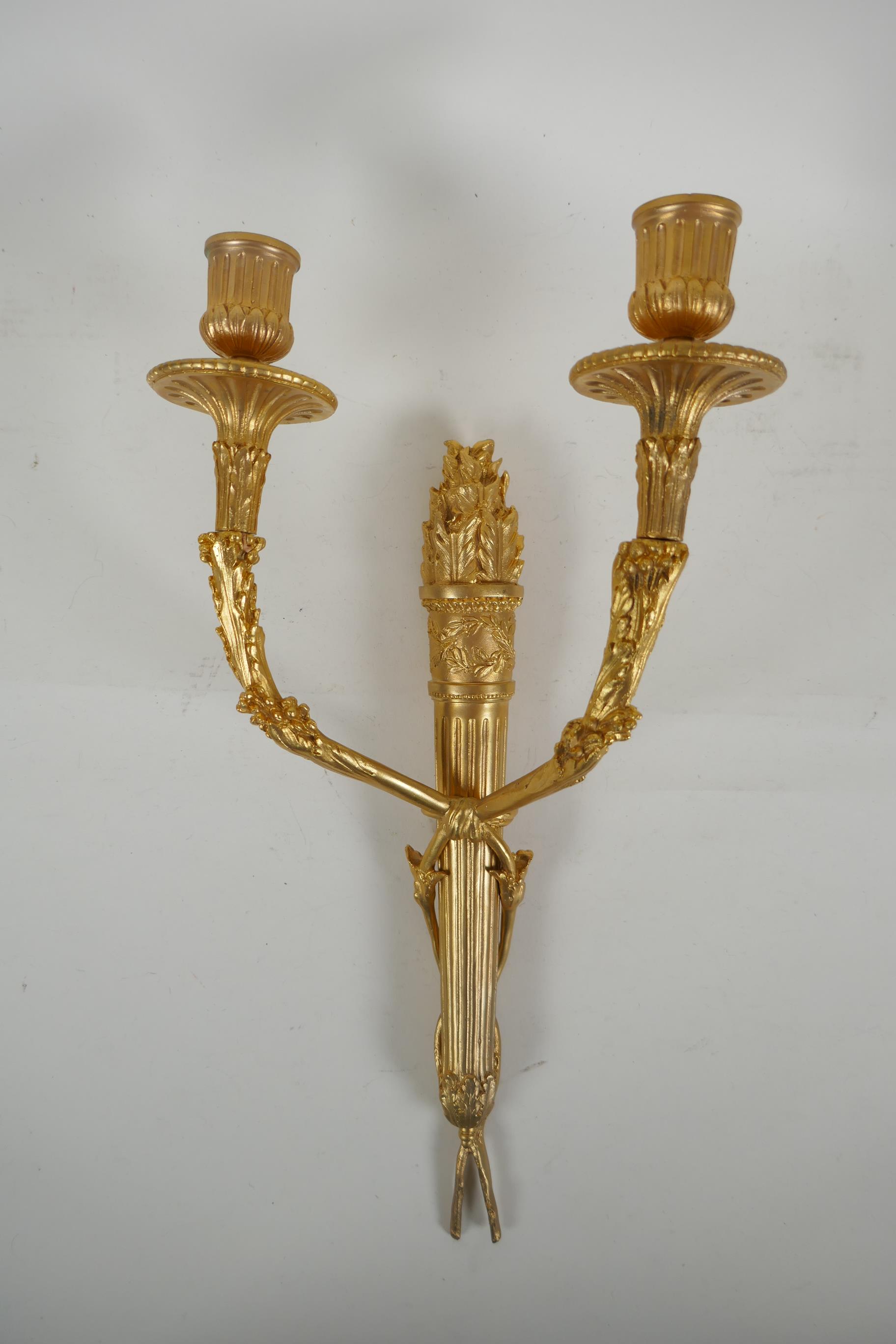 An ormolu two branch wall sconce in the form of an arrow quiver, 38cm high