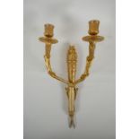 An ormolu two branch wall sconce in the form of an arrow quiver, 38cm high