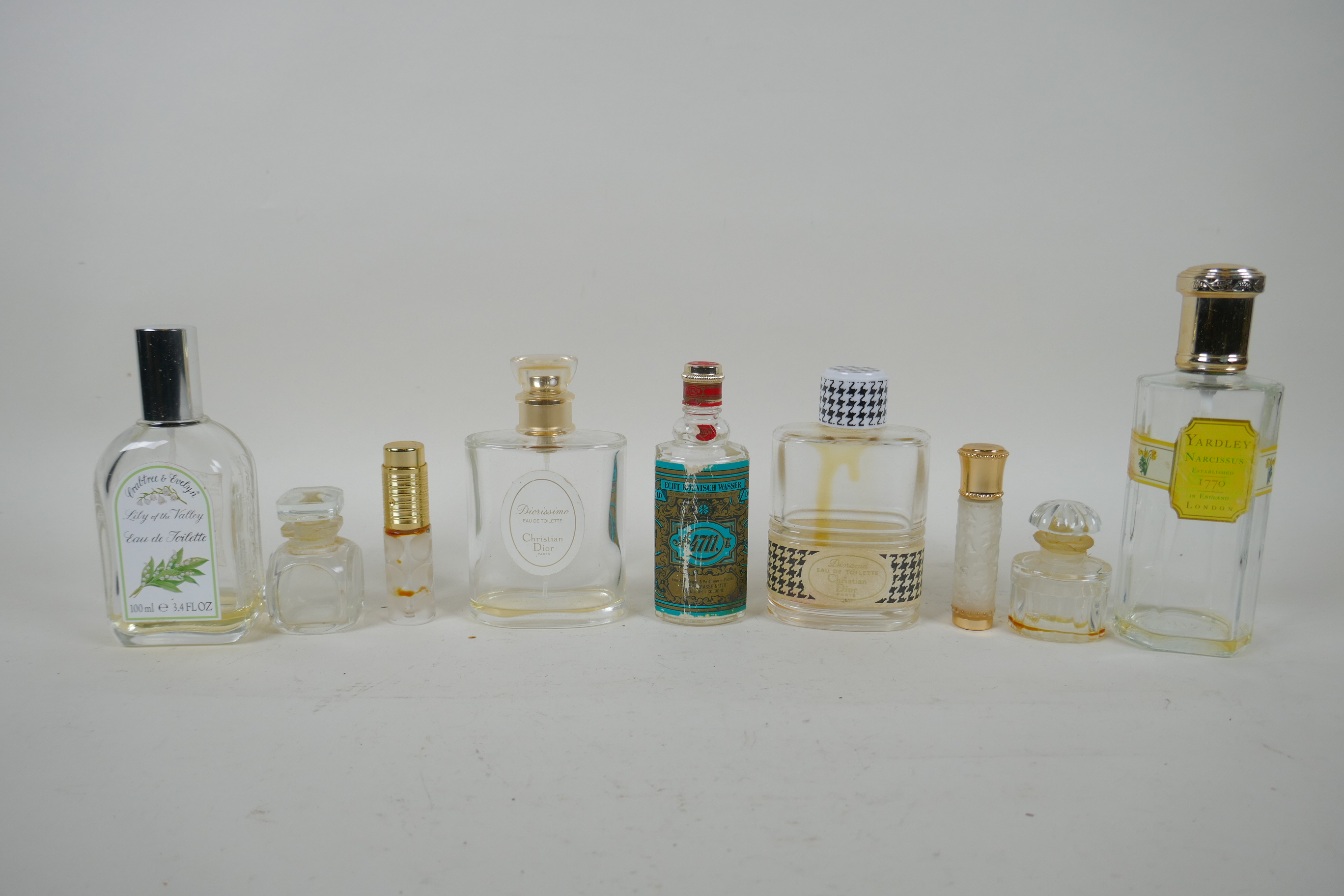 A collection of vintage perfume bottles including Christian Dior 'Diorissimo' and 'Diorama',