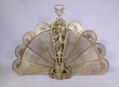 A brass fan shaped fire guard, handle detached and retaining clip, AF, 125 x 87cm
