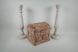 A pair of painted and distressed turned wood pricket candle sticks, and a metal strapped and