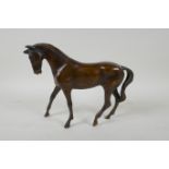 A filled bronze figure of a horse, 24cm long