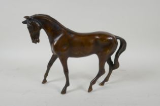 A filled bronze figure of a horse, 24cm long