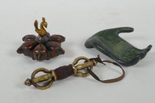 An Indian bronze six section tikka pot, a filled bronze Buddha's hand, and a Tibetan bronze vajra,