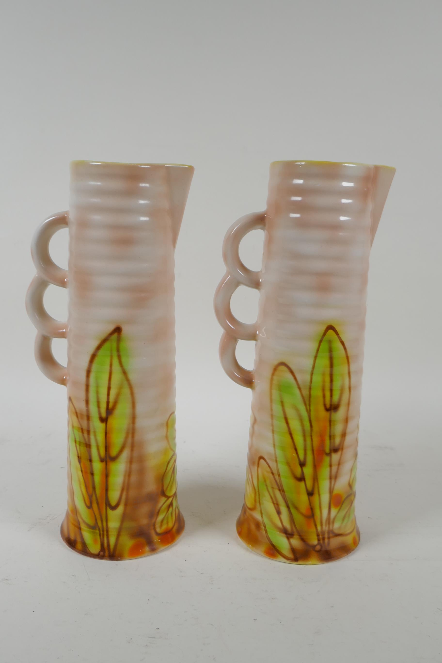 A pair of Royal Art Pottery jugs with floral decoration, 24cm high - Image 2 of 3