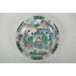 A Chinese KangXi style famille vert porcelain charger decorated with female travellers and deer