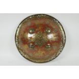 A Murghal bronze shield with enamelled lion hunt decoration, the pierced rim decoration with fish,