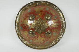 A Murghal bronze shield with enamelled lion hunt decoration, the pierced rim decoration with fish,