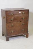 A Georgian mahogany commode with lift up top and false drawers, raised on bracket supports, 62 x