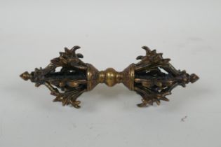 A Tibetan bronzed metal vajra, 16cm long