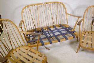 An Ercol hoop back cottage suite, settee and two arm chairs