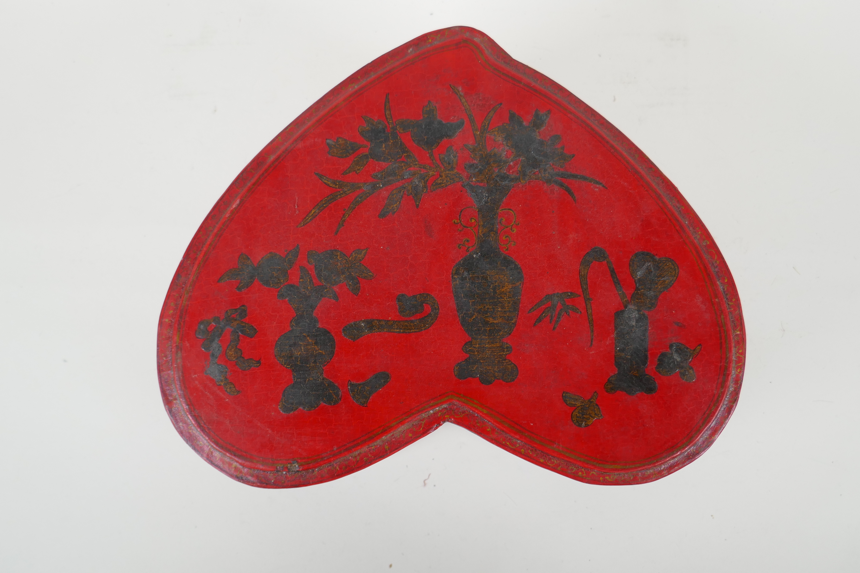A Chinese red lacquered heart shaped box decorated with objects of virtue in gilt, 32 x 26cm - Image 3 of 6