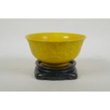 A yellow ground porcelain rice bowl with raised triple dragon decoration, Chinese YongZheng 6