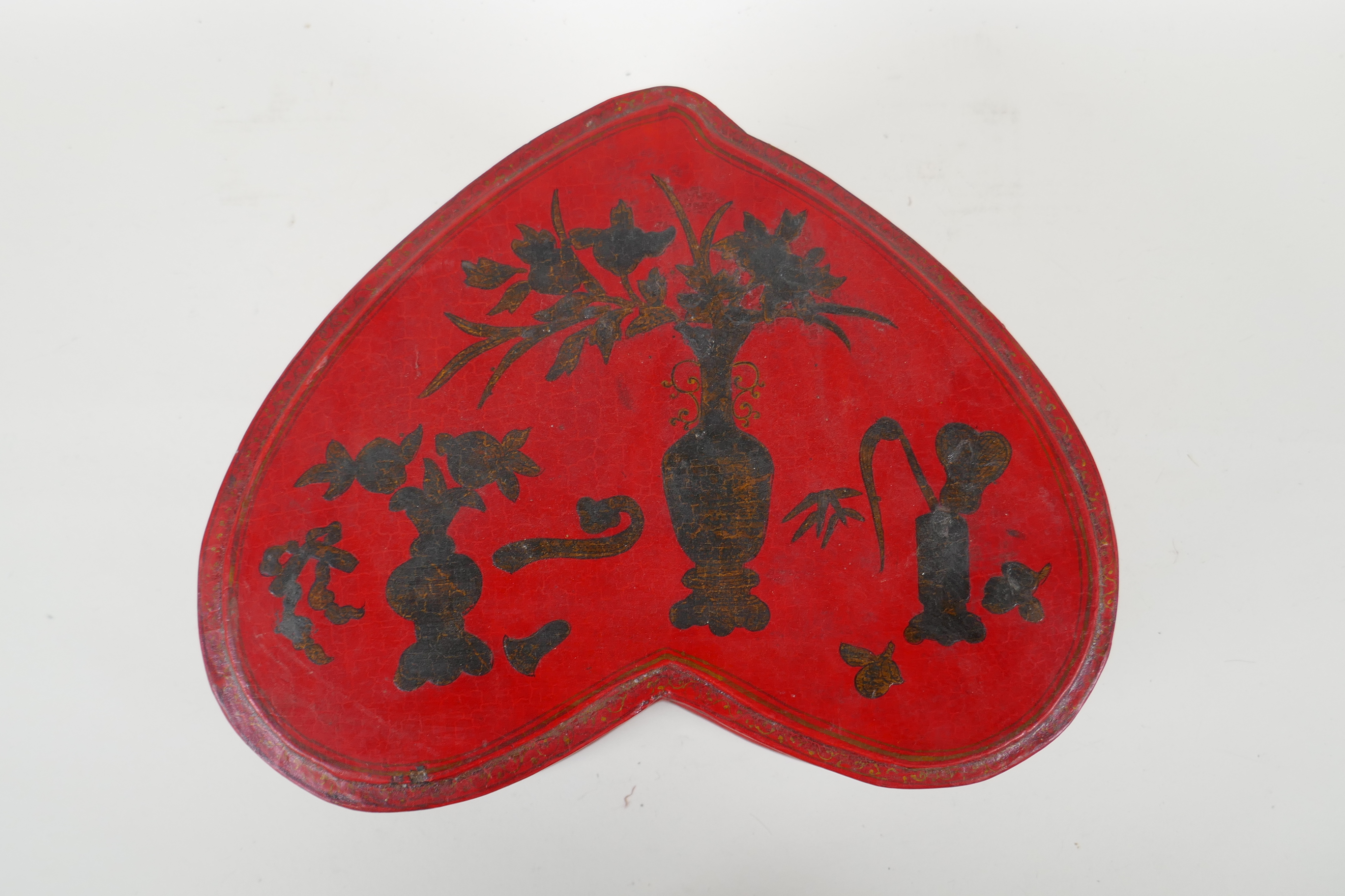 A Chinese red lacquered heart shaped box decorated with objects of virtue in gilt, 32 x 26cm - Image 5 of 6