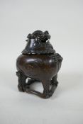 A Chinese bronze censer in the form of a kylin, impressed 4 character mark to base, 12cm high