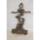 A Victorian style cast iron stick stand in the form of a seated dog with the legend Cave Canem, 75cm