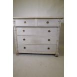 A C19th continental pine commode of two over three drawers flanked by column mouldings, raised on