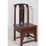 A Chinese hardwood low chair with carved and gilt back splat, 78cm high