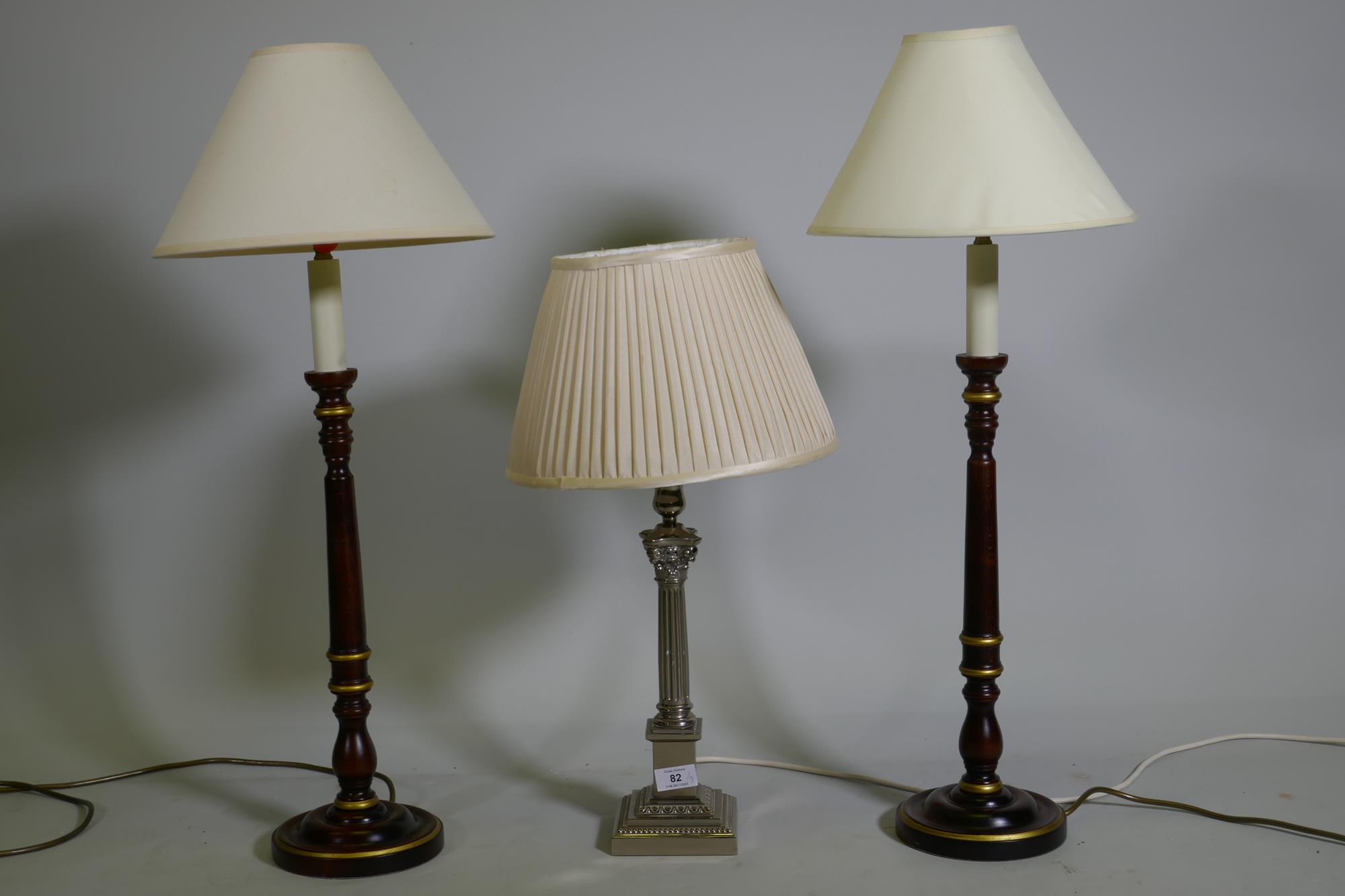 An electro plated Corinthian column style table lamp with pleated shade, 56cm with shade, and a pair