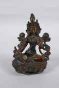 A Tibetan bronze of Green Tara, 9cm high