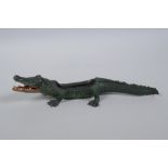 After Bergmann, a cold painted bronze in tray in the form of a crocodile, 22cm long